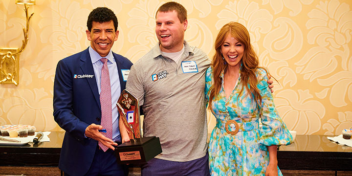 Group photo of WPT President & CEO Adam Pliska, ClubWPT 2022 POY winner Mark Symons and WPT TV Show Host Lynn Gilmartin