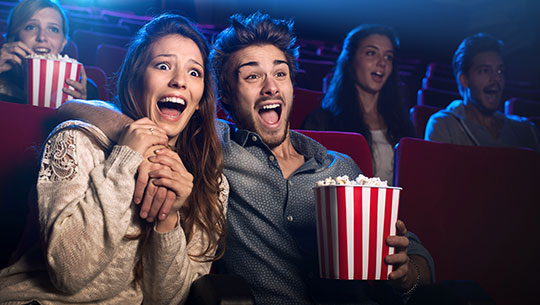 Young couple at the movie theater